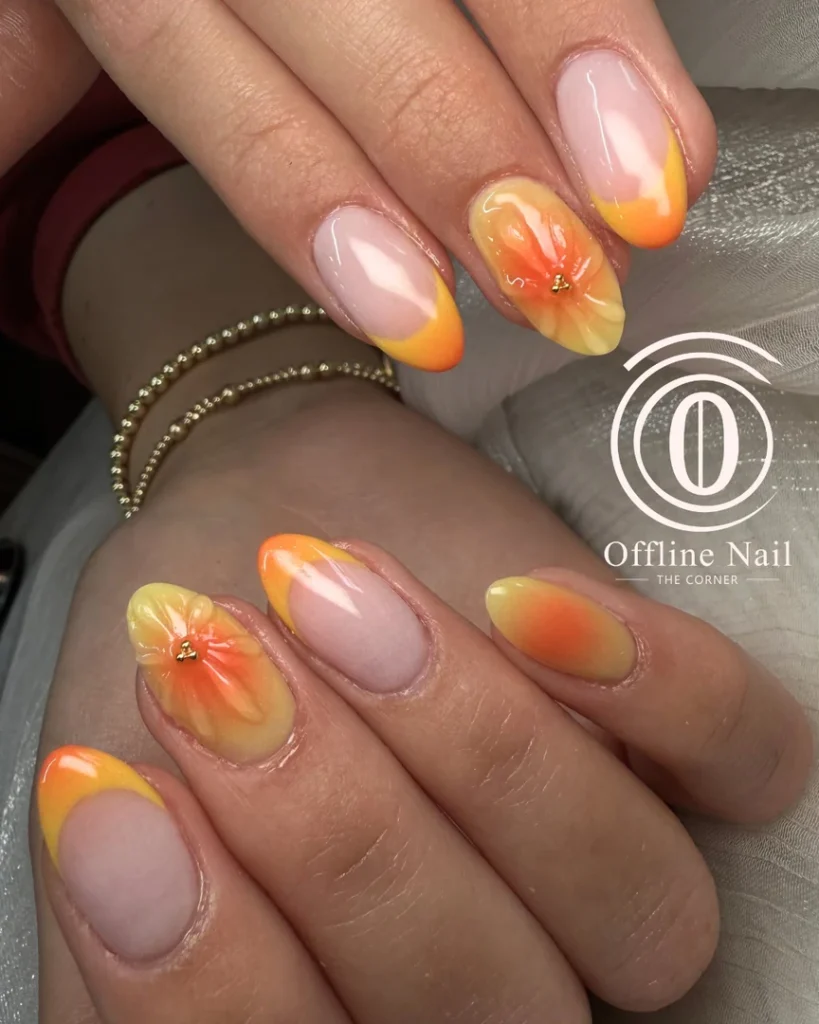 Bright citrus-inspired orange and pink nail art