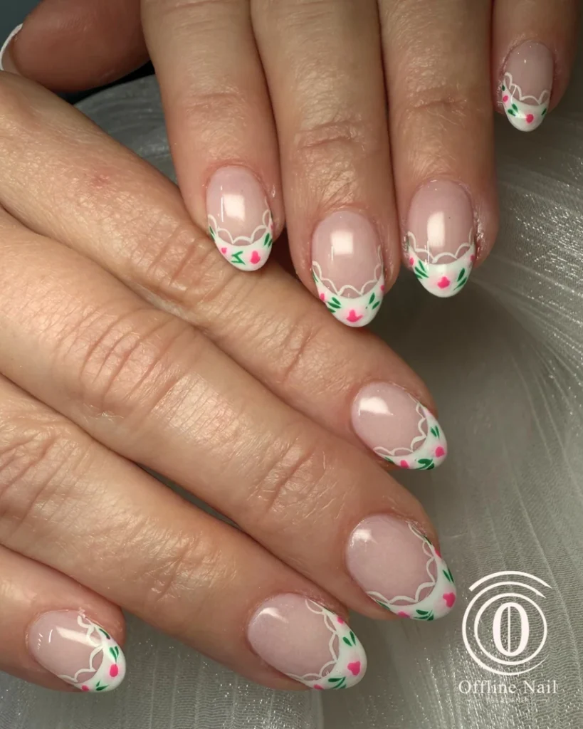 Pink and green floral French tip manicure